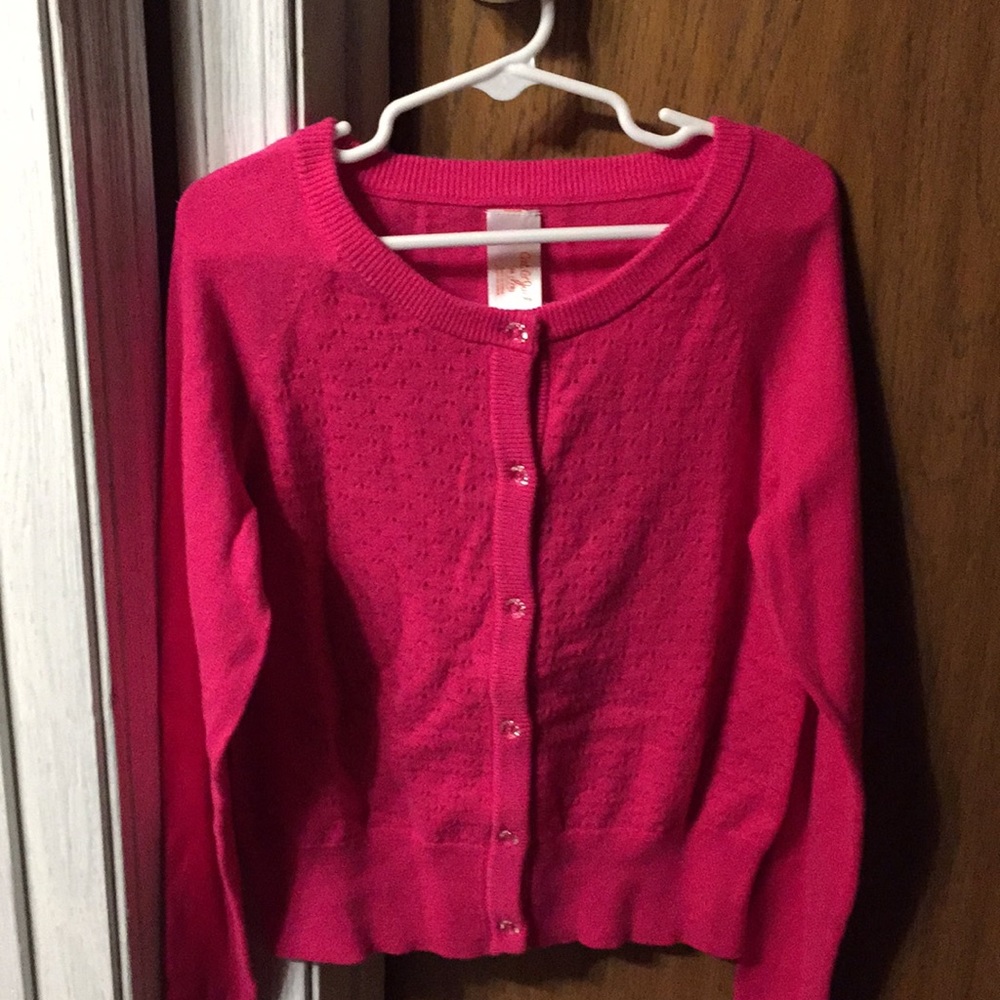 I am selling a pink child’s sweater!
